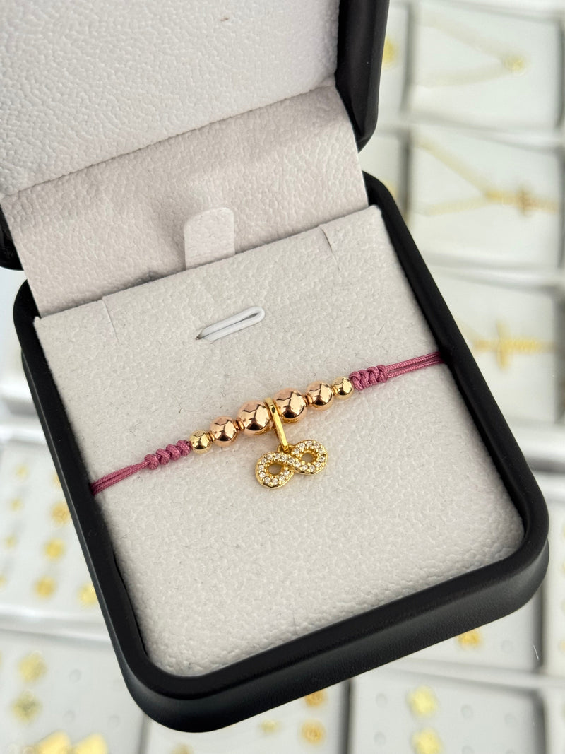 Pulsera infinito circonia oro rosa. N° de Balín: #4, #5 rosa, #6 rosa.